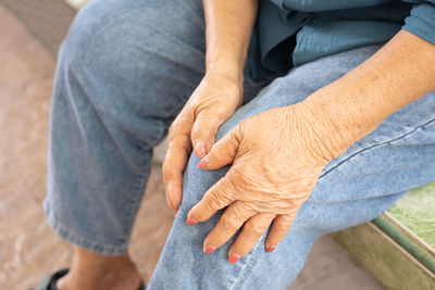 Midsection of couple hands