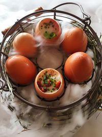 High angle view of egg in wire basket