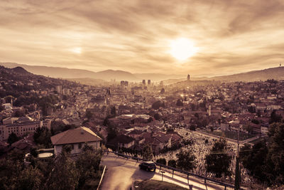 High angle shot of townscape against sky at sunset