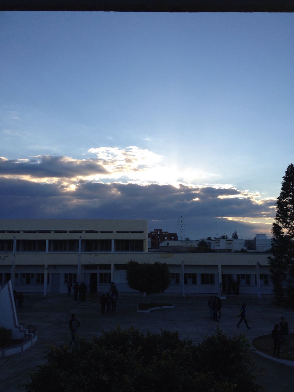 sky, architecture, built structure, building exterior, cloud - sky, tree, cloud, nature, large group of people, city, outdoors, blue, day, incidental people, person, beach, sunlight, house, lifestyles