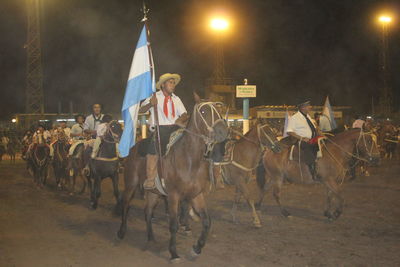 Panoramic view of people at night