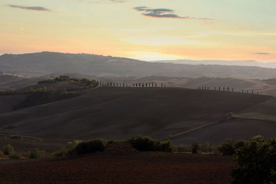 Scenic view of landscape against sky during sunset