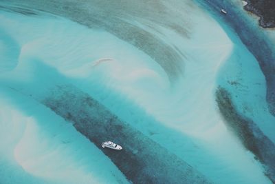 Aerial view of boat sailing on sea