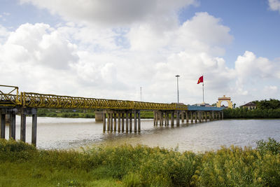 Bridge over river against sky