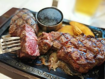 Close-up of meat on barbecue grill