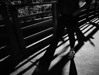 Low section of woman walking on steps
