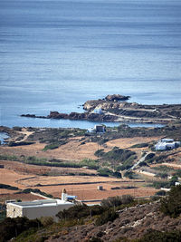 High angle view of buildings by sea against sky