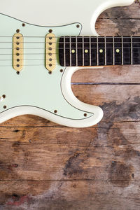 Close-up of guitar on table