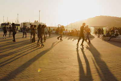 People dancing on sunset