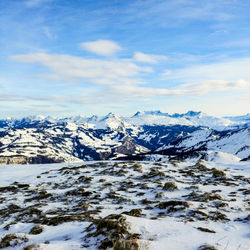 Scenic view of snowcapped mountains against sky