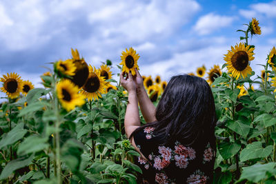 Low angle view of woman against sky