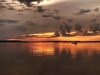 Scenic view of sea against dramatic sky