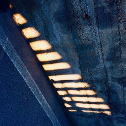 High angle view of shadow on concrete wall