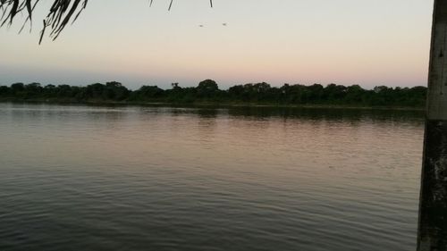 Scenic view of lake at sunset