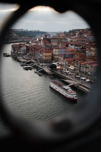 High angle view of river amidst buildings in city