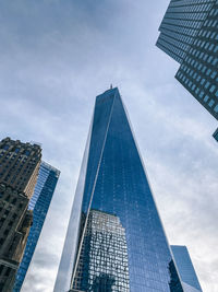 Low angle view of modern buildings against sky 911 memorial 