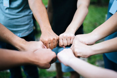 Midsection of man holding hands