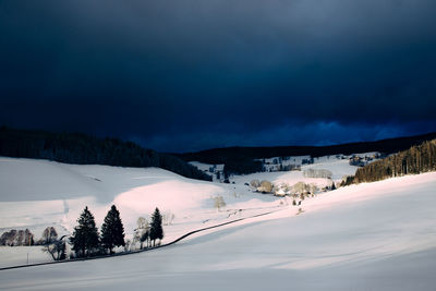 Scenic view of snowcapped mountains against sky during winter