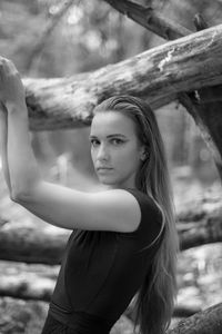 Portrait of young woman standing outdoors
