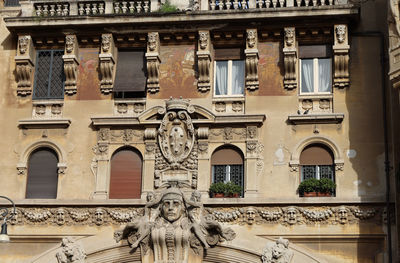 Low angle view of statues on building