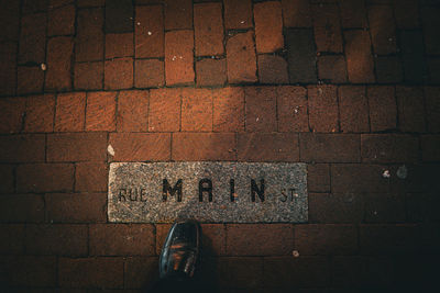 Low section of man standing on street