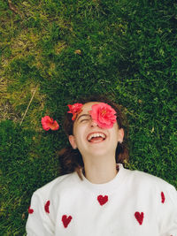 Portrait of young beauty woman standing on grassy field