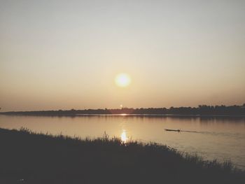 Dramatic sky over lake during sunset