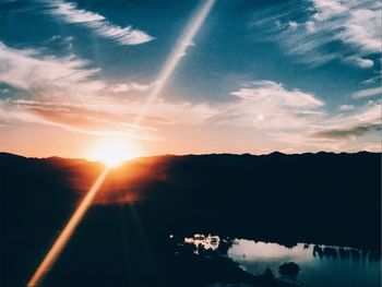 Scenic view of silhouette mountains against sky during sunset