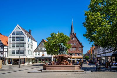 Buildings against blue sky in city