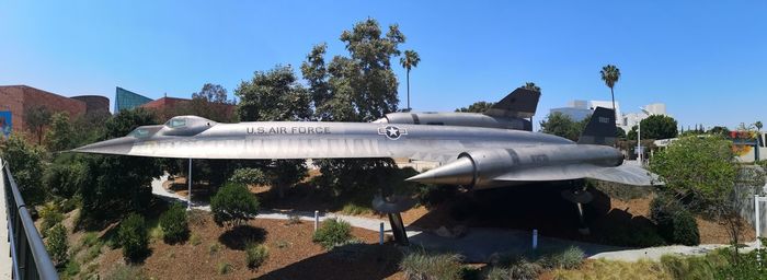 Scenic view of trees against clear blue sky