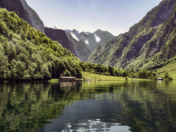 Scenic view of lake and mountains against sky