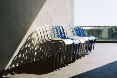 Empty seats in row against wall
