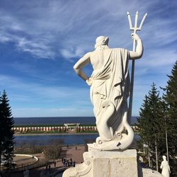 Low angle view of statue against cloudy sky