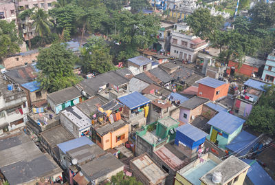 High angle view of buildings and trees in city