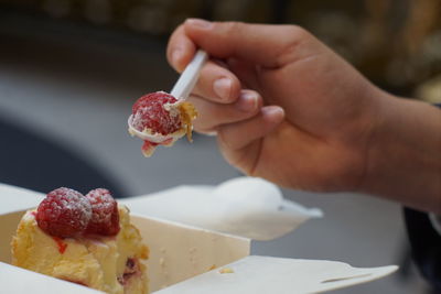 Cropped image of hand holding ice cream