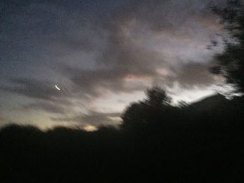 Low angle view of dramatic sky at night