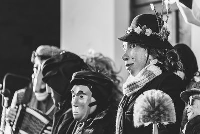 Ancient carnival of sauris. traditional wooden masks. black and white. italy