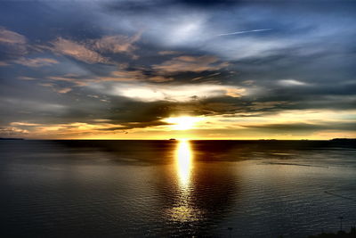 Scenic view of sea against dramatic sky