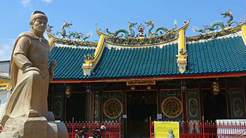 Low angle view of statues against building