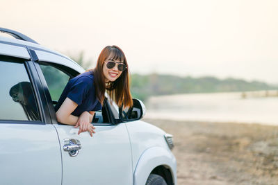 Portrait of young woman wearing sunglasses