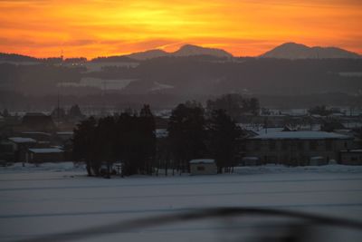 Scenic view of mountains against sky at sunset