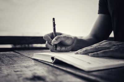 Close-up of man working on table