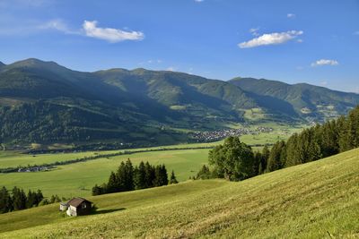 Scenic view of landscape and mountains against sky