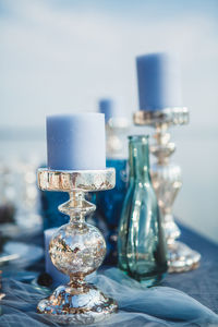 Close-up of candlestick holder on table