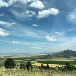 Scenic view of landscape against cloudy sky