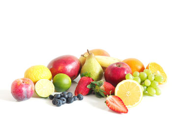 Close-up of fruits on white background