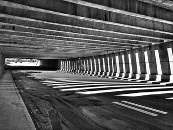 Empty road along trees