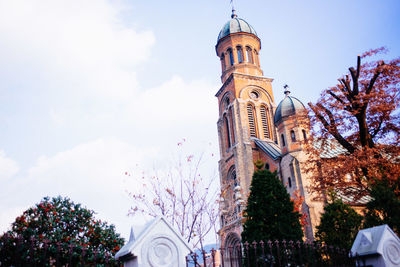 Low angle view of clock tower against sky