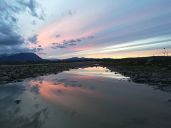 Scenic view of lake against sky during sunset