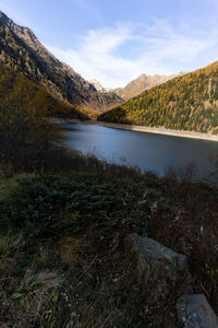 Scenic view of lake and mountains against sky